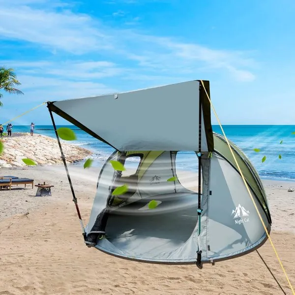 Night Cat pop‑up tent beach scene